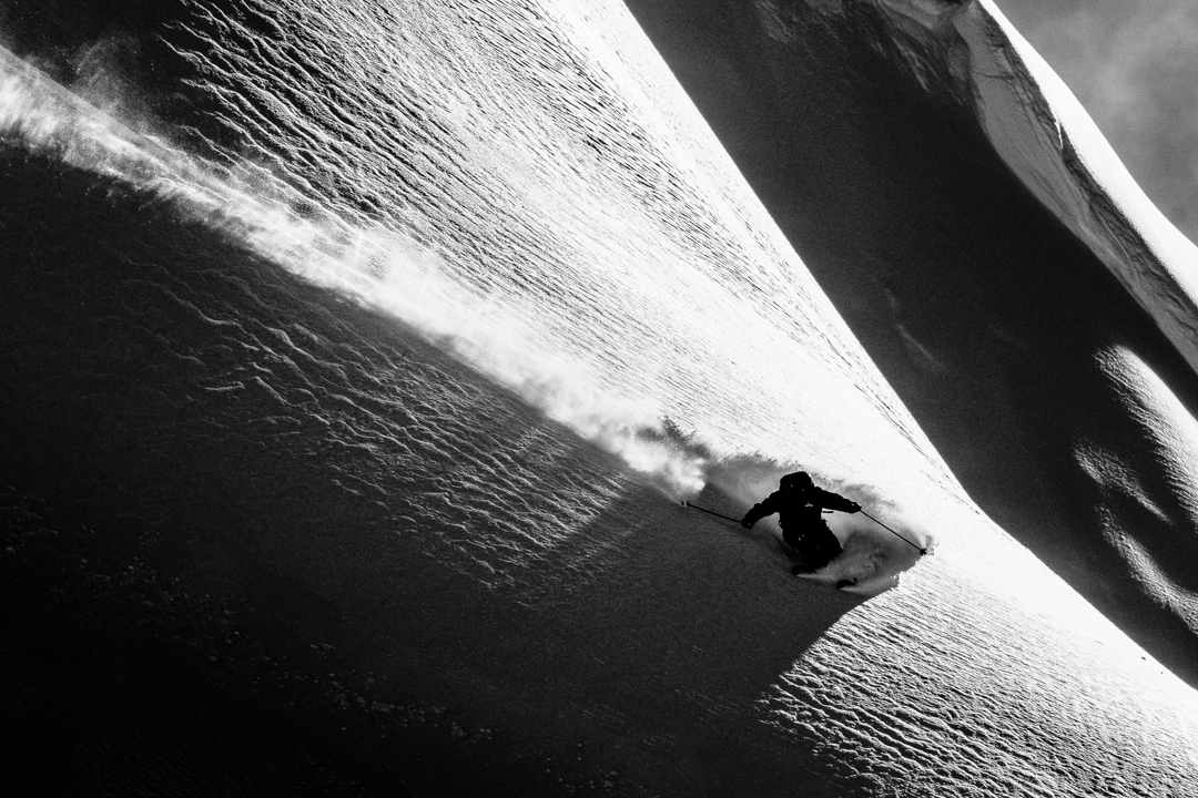 Sun and shadows on a skier in Alaska.