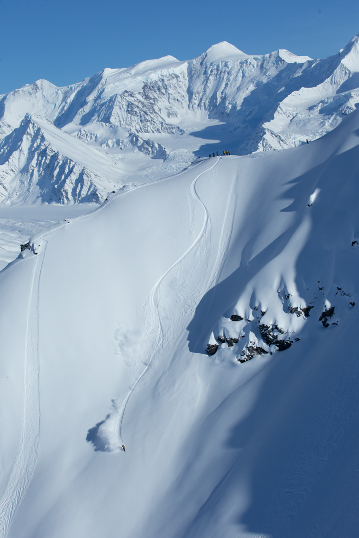 Skiing with an amazing background with Chugach Powder Guides.